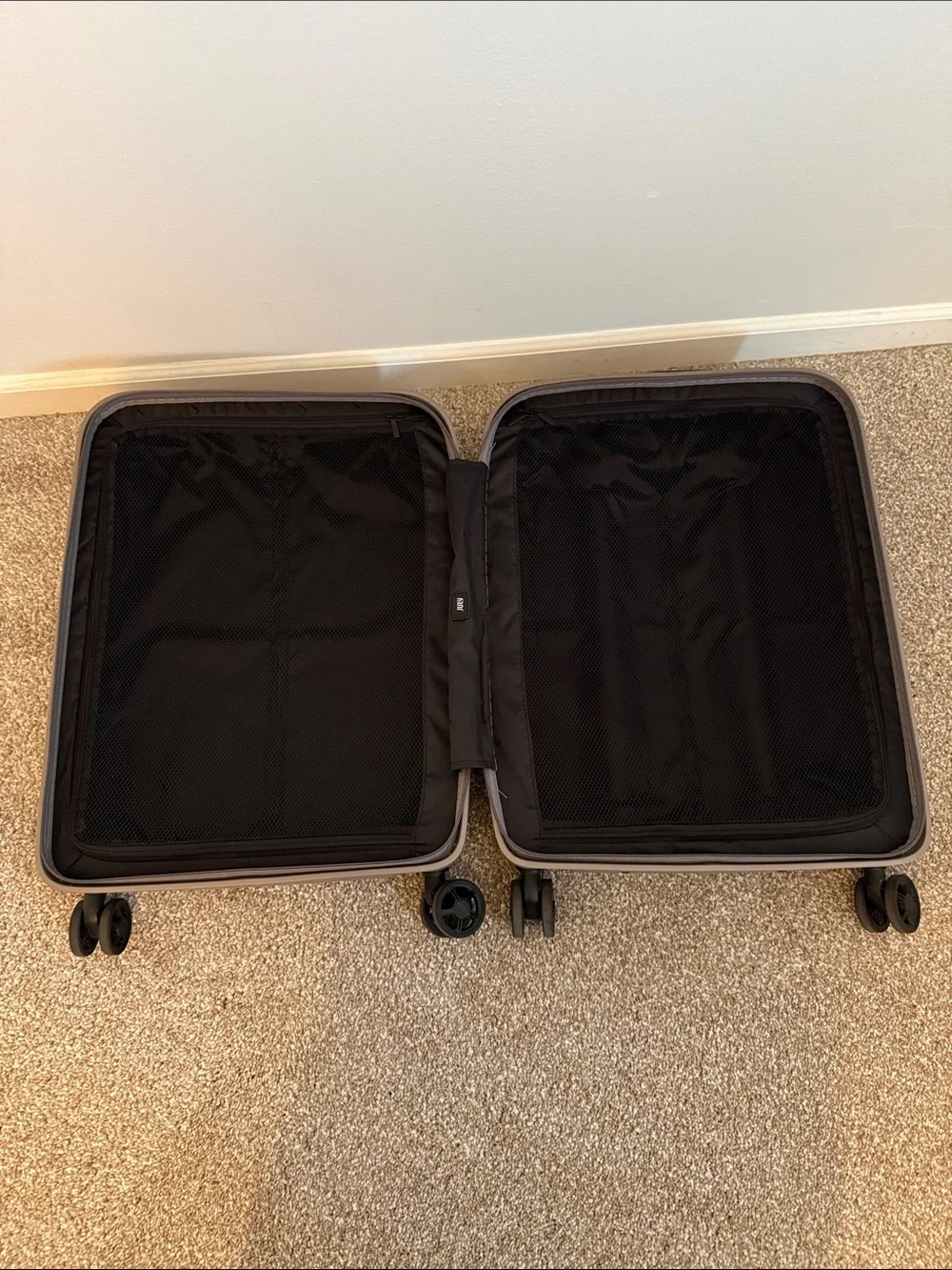 Compact Beige Rolling Storage Case with Smooth Wheels